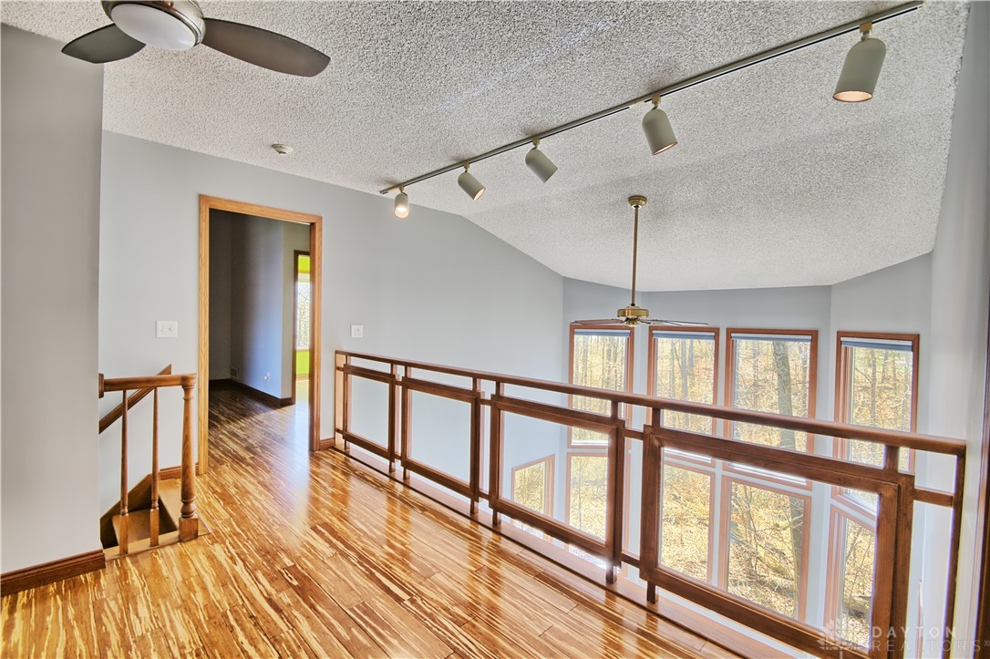 8711 Nicole Lane Springboro, OH 45066 - Photo 34 of 87 This interior hallway offers a unique vantage point with expansive views through large windows.