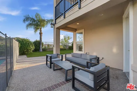 a aerial view of a house with a patio