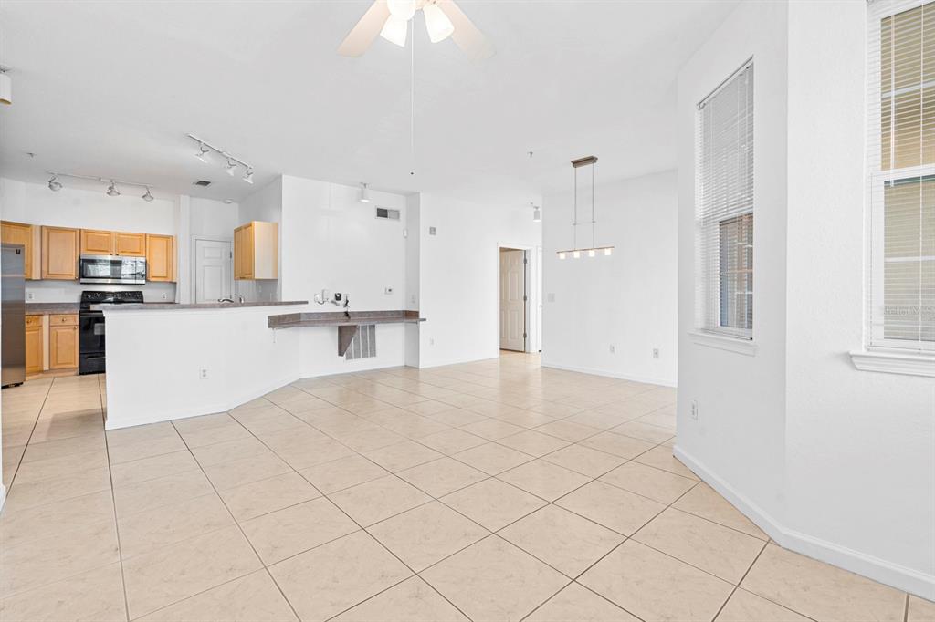 707 Terrace Ridge Circle, Unit 707 Davenport, FL 33896 - Photo 19 of 59 a view of a kitchen with a sink