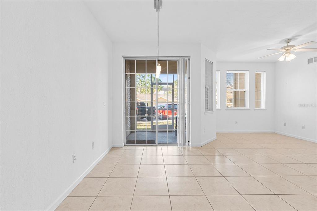707 Terrace Ridge Circle, Unit 707 Davenport, FL 33896 - Photo 23 of 59 a view of an empty room with a window