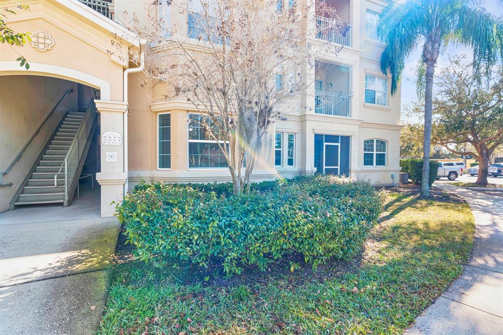 707 Terrace Ridge Circle, Unit 707 Davenport, FL 33896 - Photo 24 of 59 a front view of a house with a yard