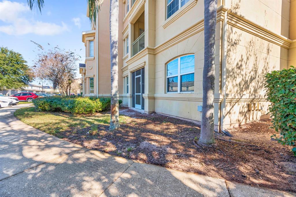 707 Terrace Ridge Circle, Unit 707 Davenport, FL 33896 - Photo 25 of 59 a view of a house with a yard