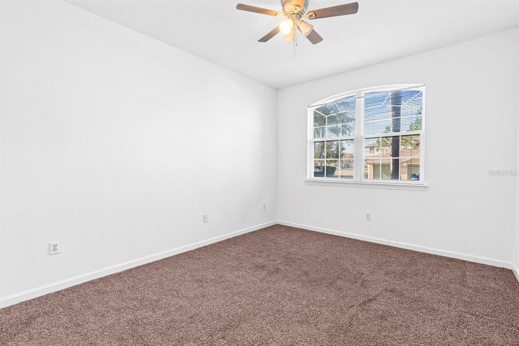 707 Terrace Ridge Circle, Unit 707 Davenport, FL 33896 - Photo 27 of 59 an empty room with a window