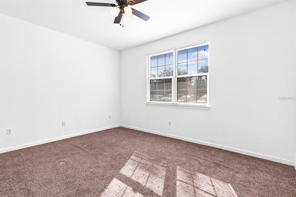 707 Terrace Ridge Circle, Unit 707 Davenport, FL 33896 - Photo 31 of 59 an empty room with a window