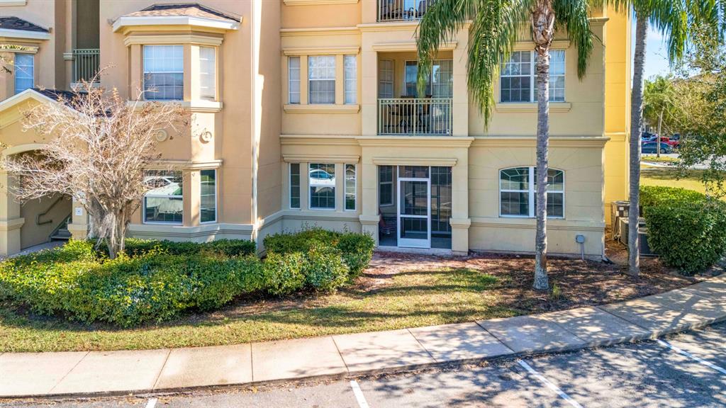 707 Terrace Ridge Circle, Unit 707 Davenport, FL 33896 - Photo 43 of 59 a front view of a house with a yard