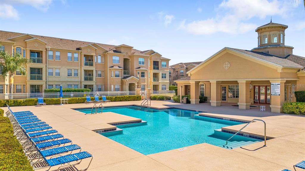 707 Terrace Ridge Circle, Unit 707 Davenport, FL 33896 - Photo 49 of 59 a front view of a house with swimming pool yard and patio