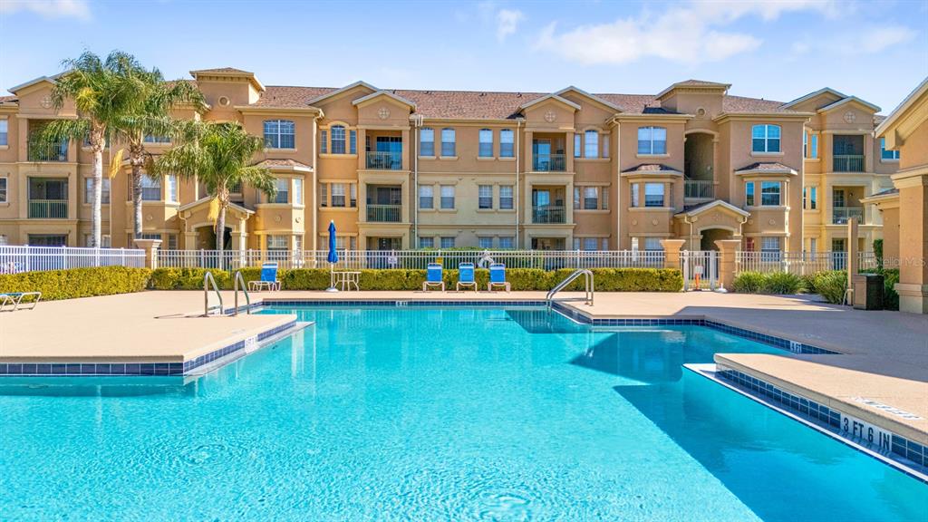 707 Terrace Ridge Circle, Unit 707 Davenport, FL 33896 - Photo 50 of 59 a view of a building with a swimming pool