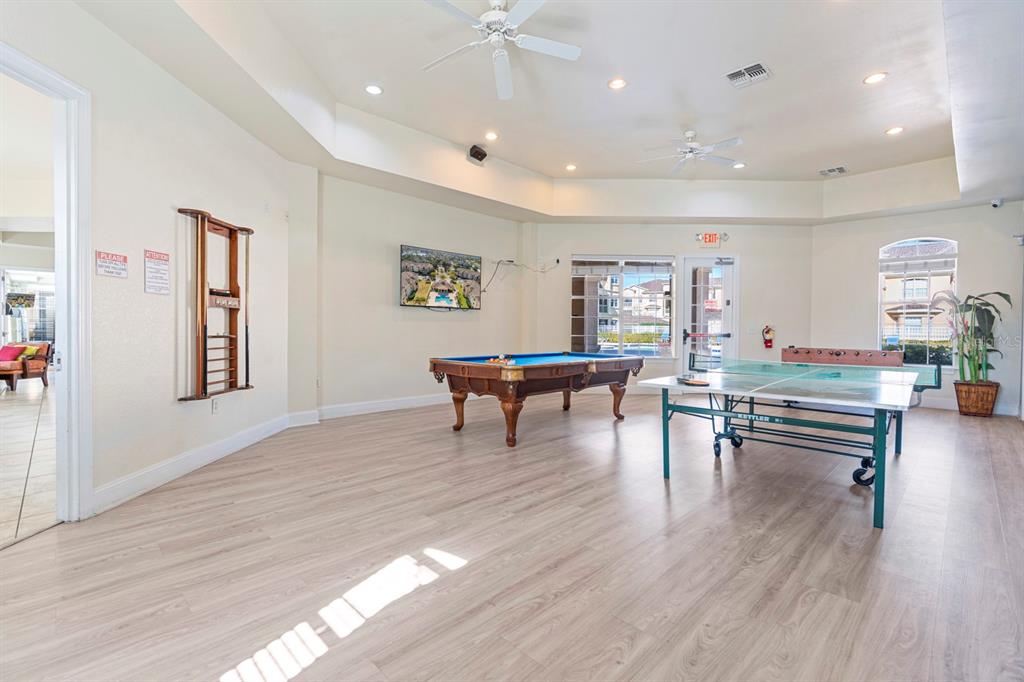 707 Terrace Ridge Circle, Unit 707 Davenport, FL 33896 - Photo 59 of 59 a living room with furniture and a wooden floor