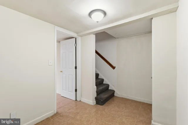a view of an empty room with stairs