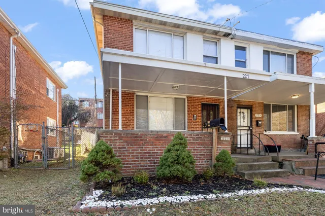 a view of a brick building with many windows