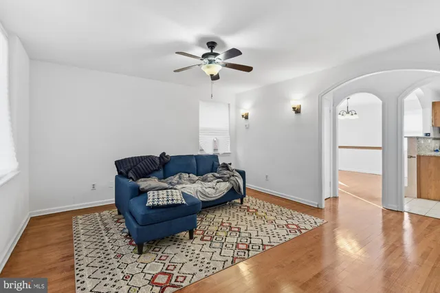 a living room with furniture and a rug