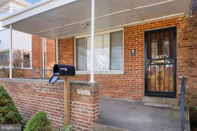 a view of a brick house with a large window