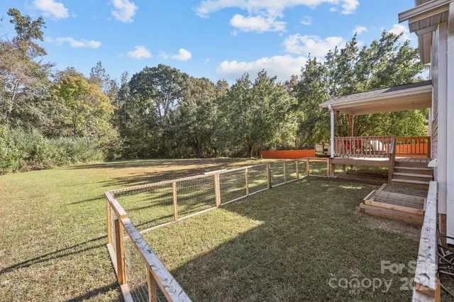 a view of a grassy field with entertaining space