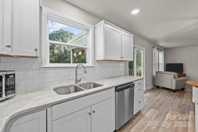a kitchen with a sink and a window
