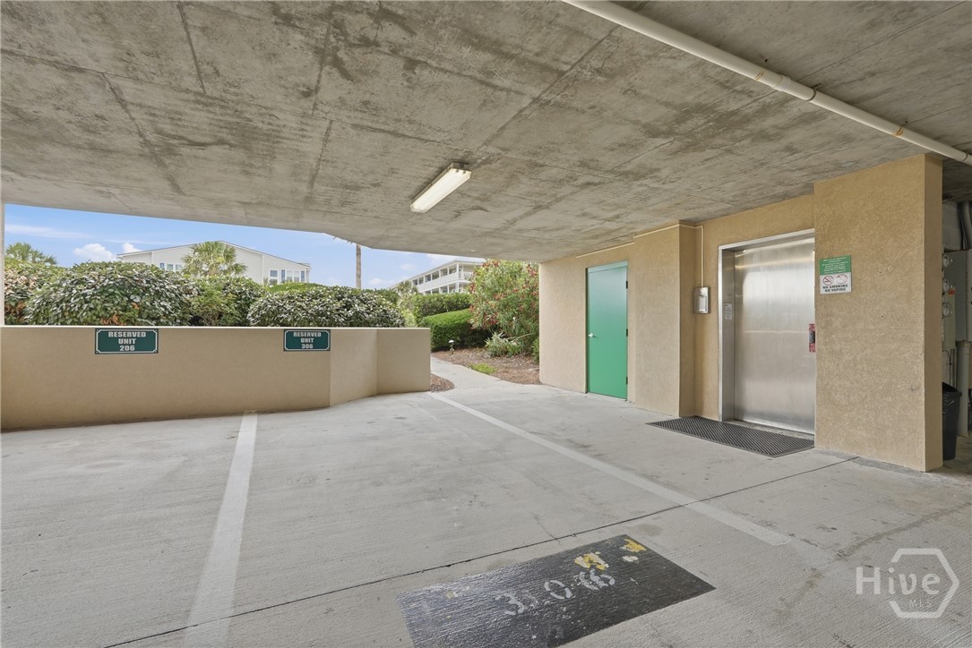 214 Butler Avenue, Unit 306 Tybee Island, GA 31328 - Photo 33 of 49 Assigned covered parking space next to Elevator entrance...Convenience.