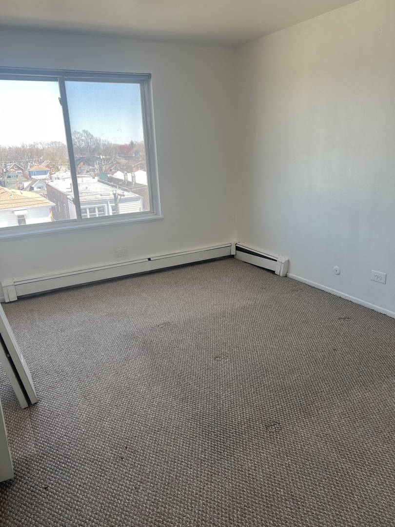 1227 South Harlem Avenue, Unit 512 Berwyn, IL 60402 - Photo 13 of 28 an empty room with a window