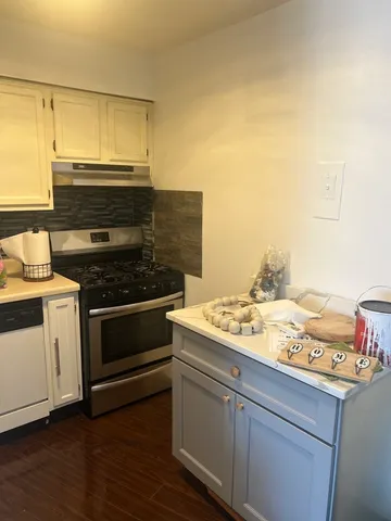 a kitchen with a stove and a microwave