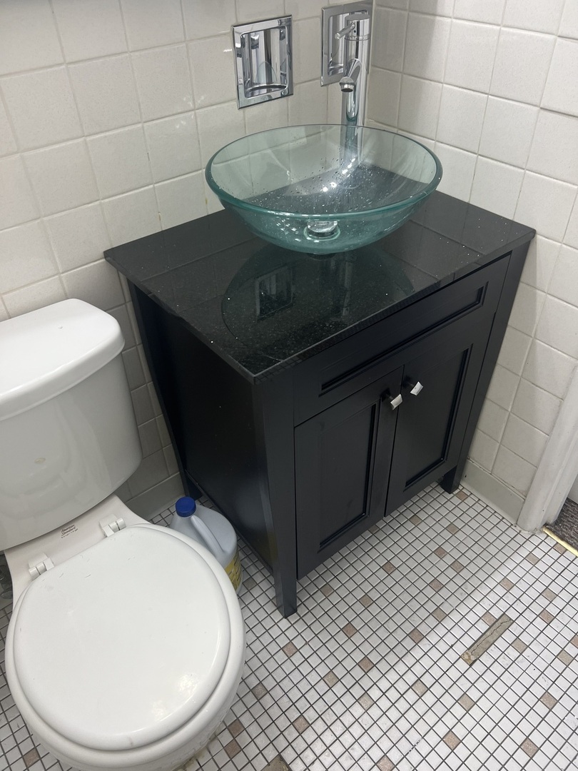 1227 South Harlem Avenue, Unit 512 Berwyn, IL 60402 - Photo 19 of 28 a bathroom with a sink toilet and mirror