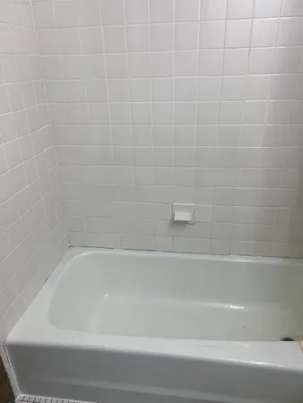 a close up of a bathtub in a bathroom