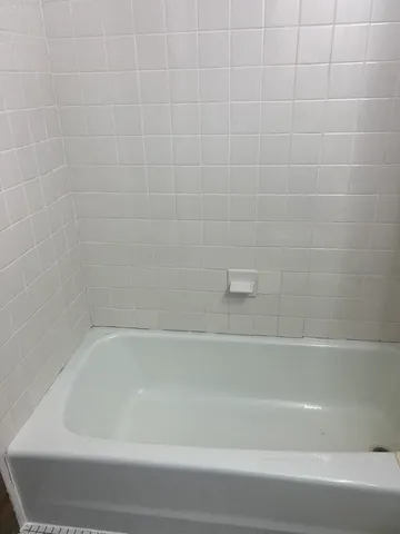 a close up of a bathtub in a bathroom