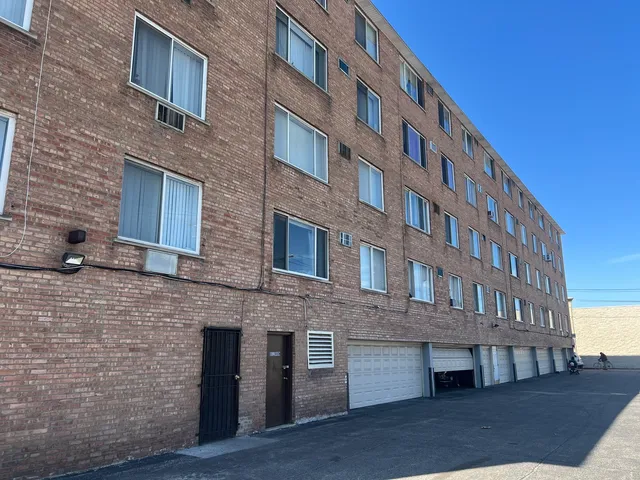 a view of brick building with many windows