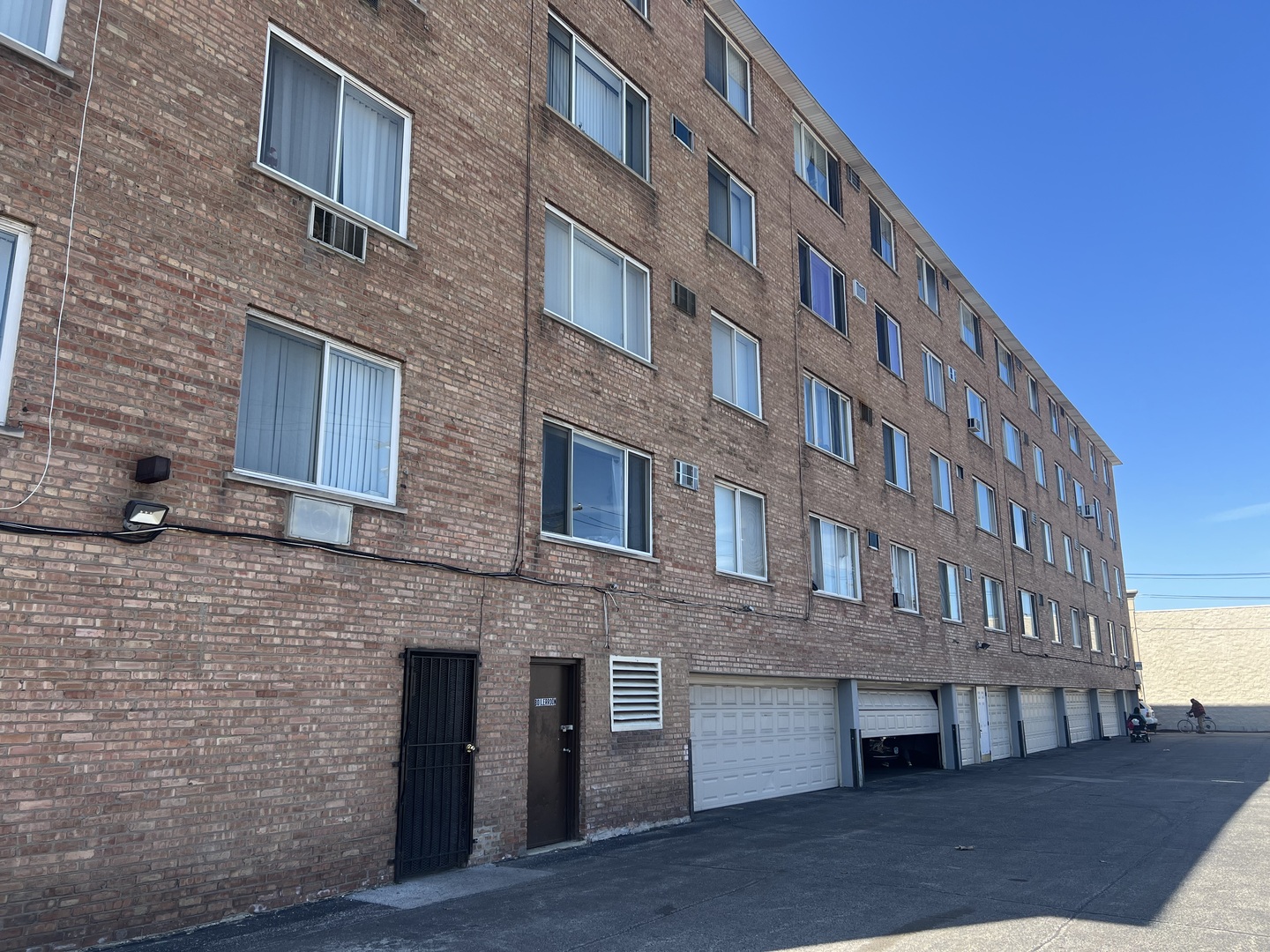 1227 South Harlem Avenue, Unit 512 Berwyn, IL 60402 - Photo 25 of 28 a view of brick building with many windows