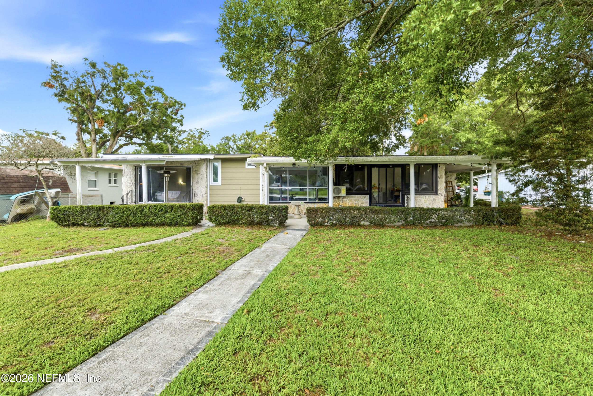 7484 Spinola Road Jacksonville, FL 32217 - Photo 56 of 63 a view of a house with a yard and sitting area