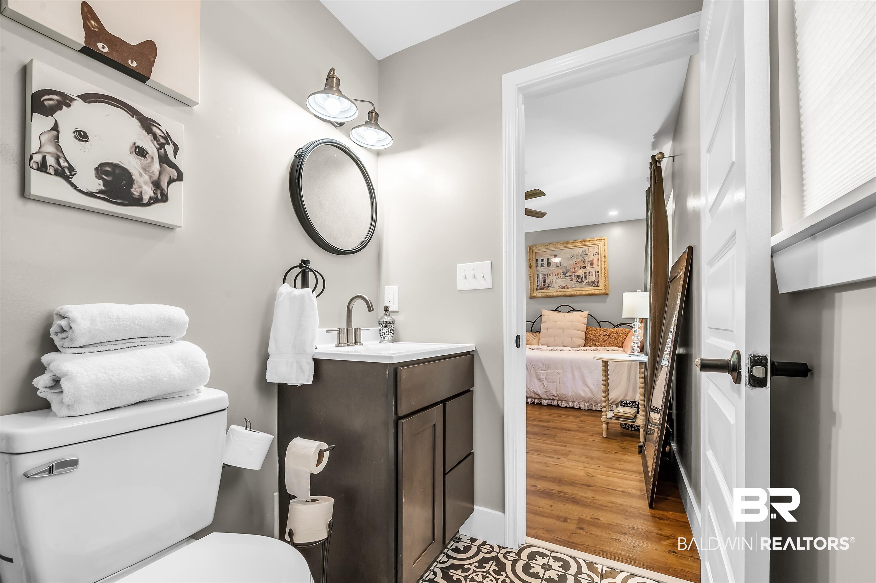 5215 Pine Road Orange Beach, AL 36561 - Photo 49 of 60 Ensuite bathroom with vanity and wood finished floors