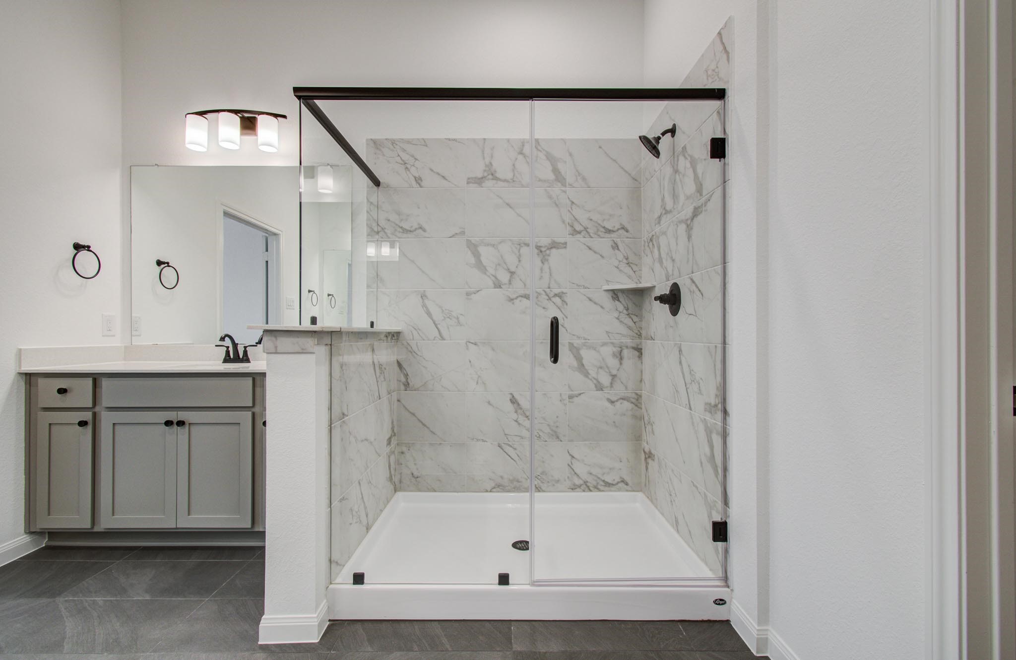 7231 Yarrow Blossom Court Katy, TX 77493 - Photo 29 of 49 a bathroom with a granite countertop sink mirror and shower
