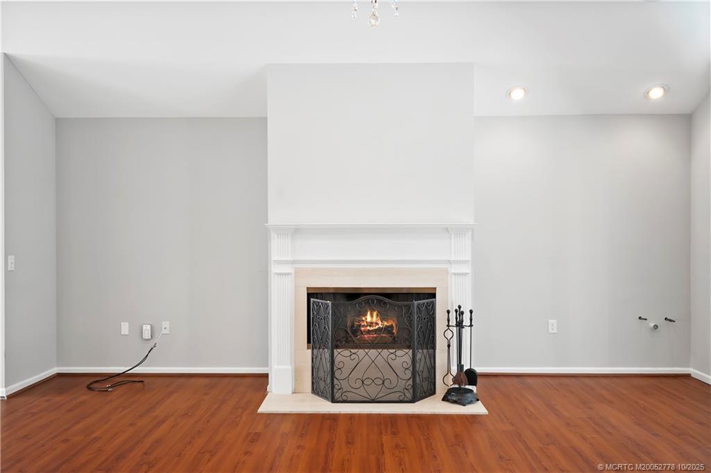 101 South Sewalls Point Road Stuart, FL 34996 - Photo 11 of 41 a view of an empty room with wooden floor and a fireplace