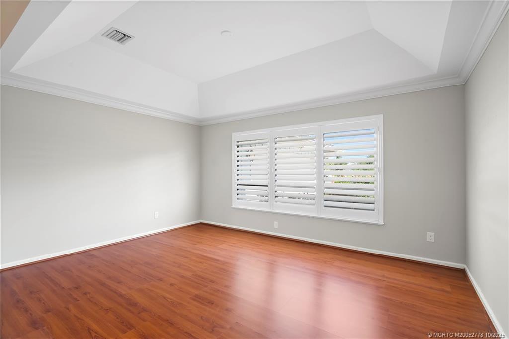 101 South Sewalls Point Road Stuart, FL 34996 - Photo 14 of 41 a view of an empty room with wooden floor and a window