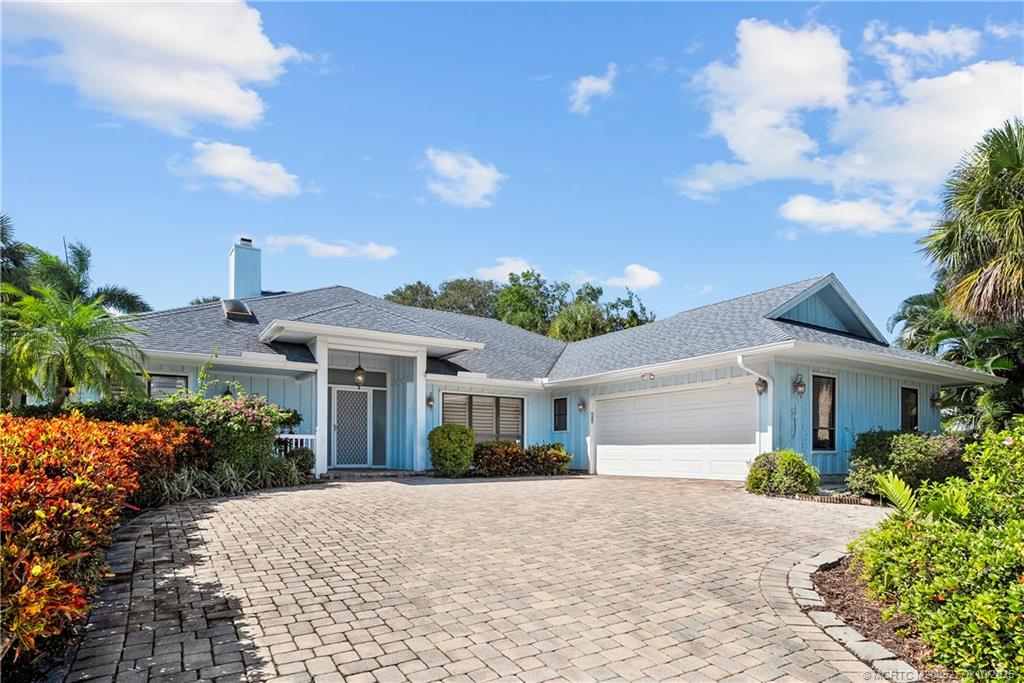 101 South Sewalls Point Road Stuart, FL 34996 - Photo 2 of 41 a front view of a house with garden