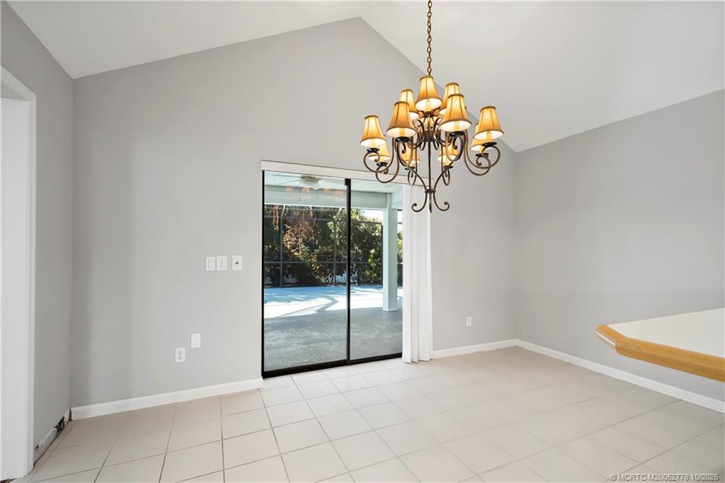 101 South Sewalls Point Road Stuart, FL 34996 - Photo 26 of 41 a view of a room with a chandelier and chandelier