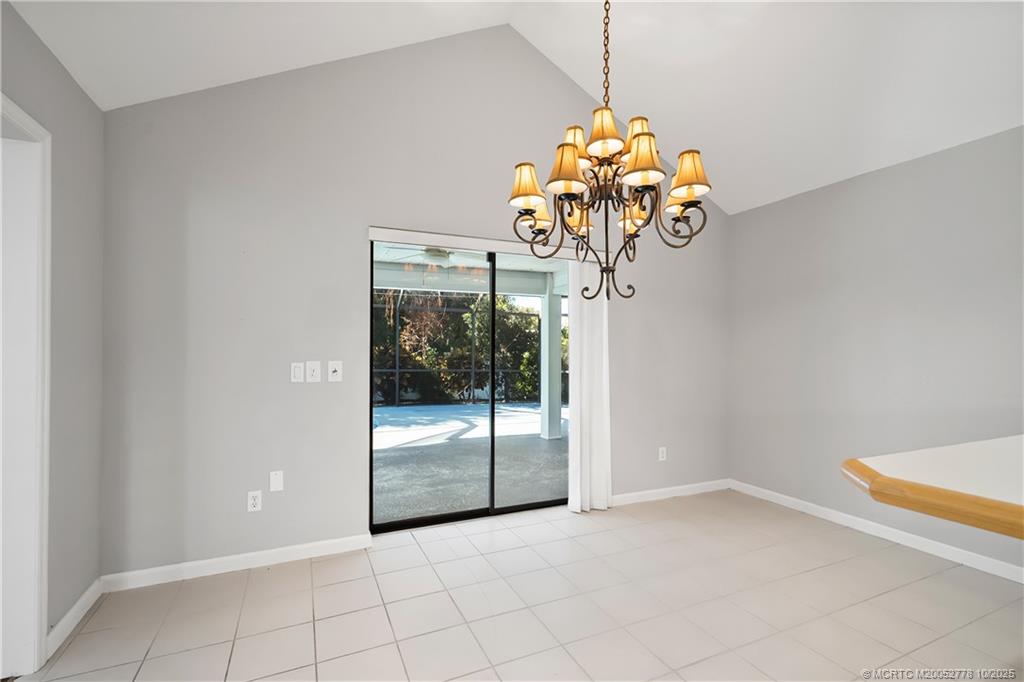 101 South Sewalls Point Road Stuart, FL 34996 - Photo 27 of 41 a view of a room with a chandelier fan and carpet