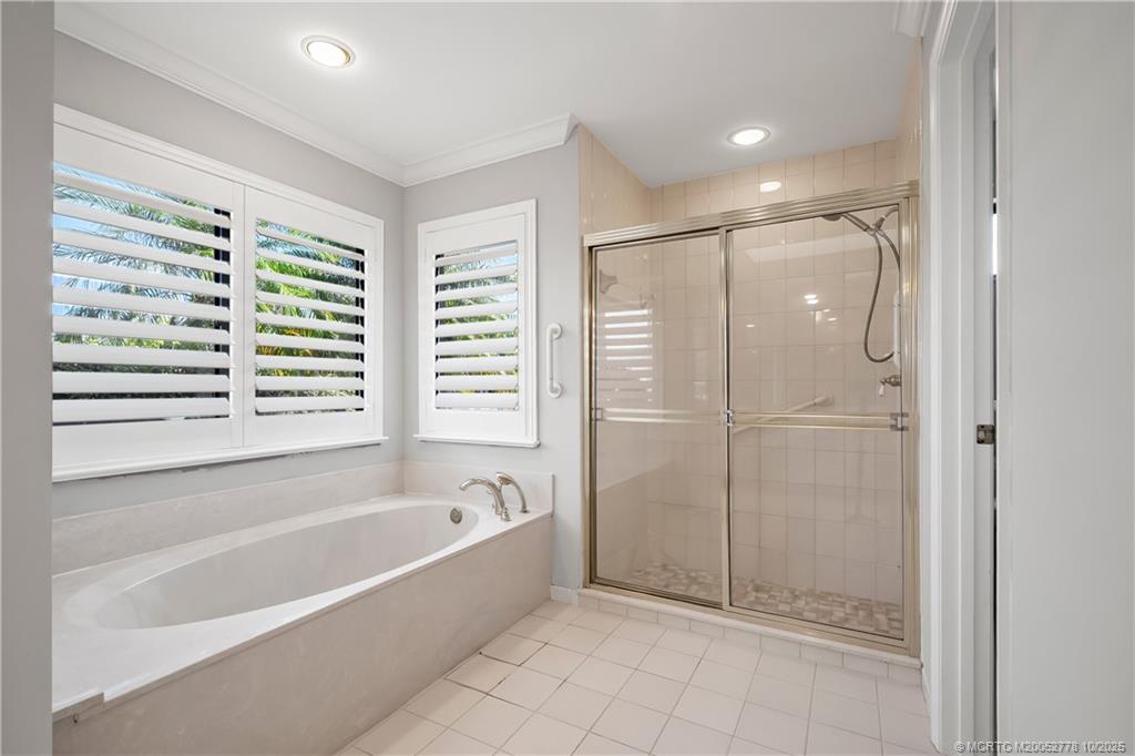 101 South Sewalls Point Road Stuart, FL 34996 - Photo 31 of 41 a bathroom with a bathtub and a shower