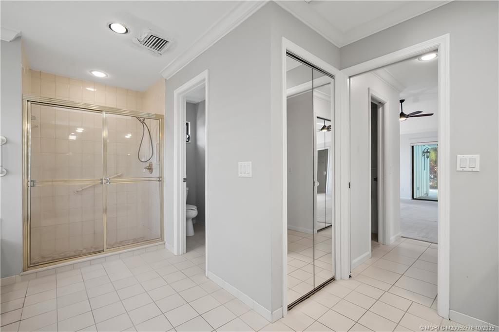 101 South Sewalls Point Road Stuart, FL 34996 - Photo 32 of 41 wooden view of a bathroom with shower sink and mirror