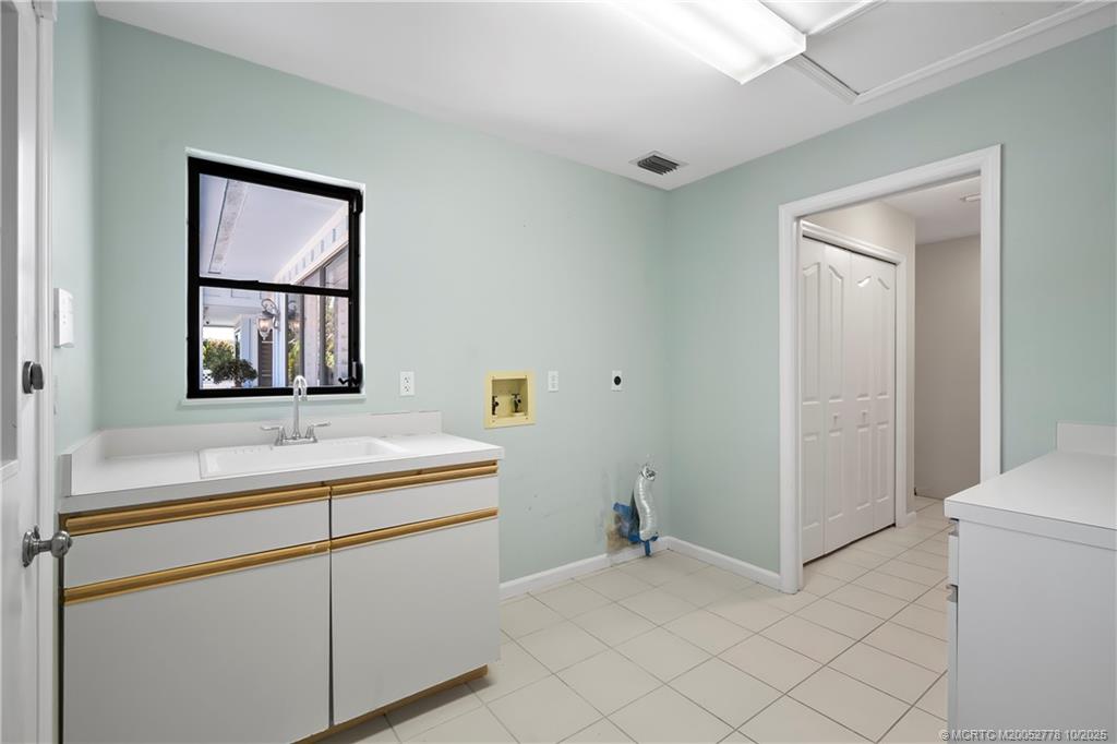 101 South Sewalls Point Road Stuart, FL 34996 - Photo 33 of 41 a bathroom with a sink and a mirror