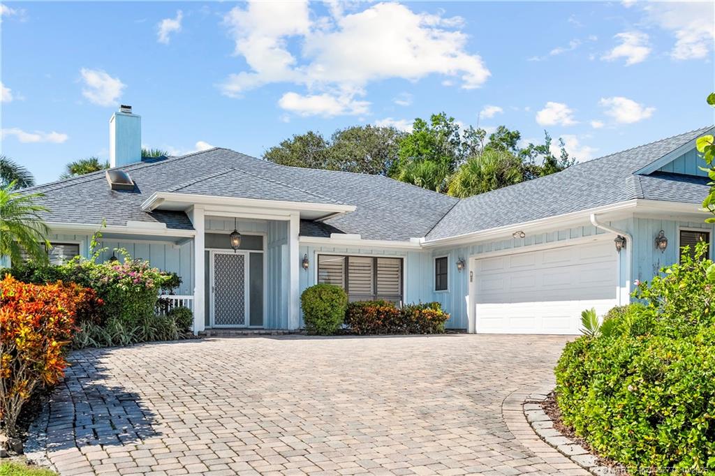 101 South Sewalls Point Road Stuart, FL 34996 - Photo 6 of 41 a front view of a house with garden