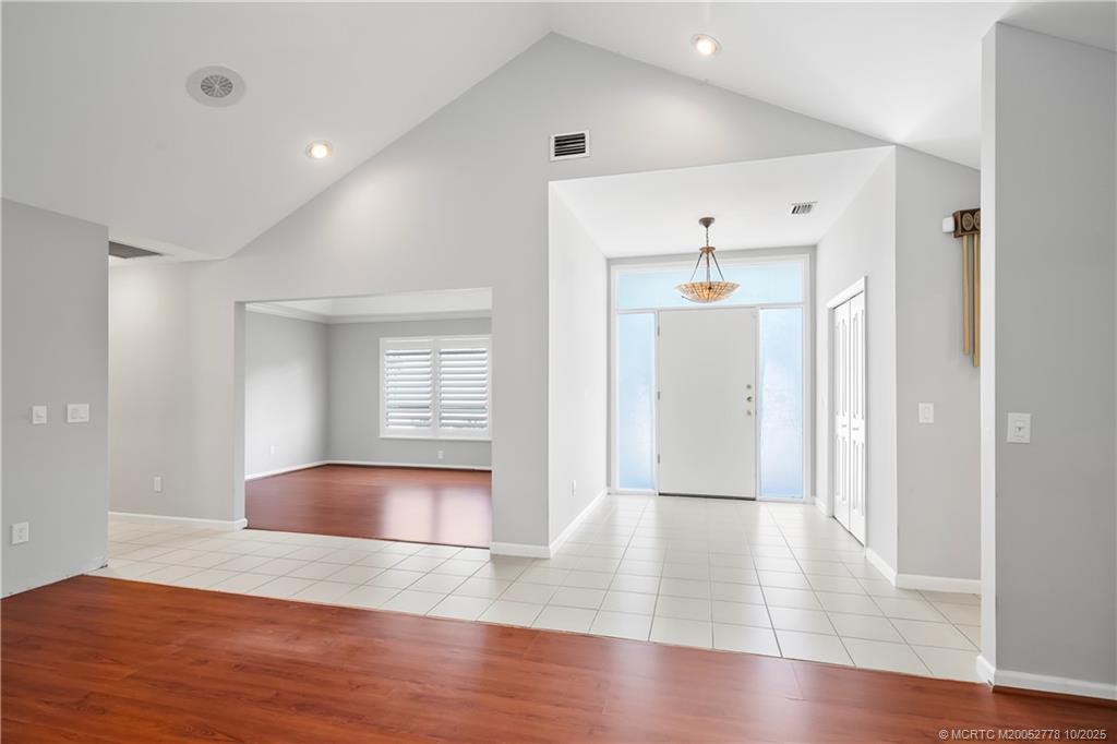 101 South Sewalls Point Road Stuart, FL 34996 - Photo 8 of 41 wooden floor in an empty room with a window