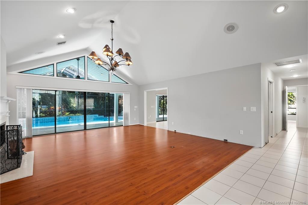 101 South Sewalls Point Road Stuart, FL 34996 - Photo 9 of 41 an empty room with wooden floor and windows