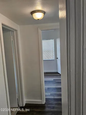 a view of entryway with wooden floor