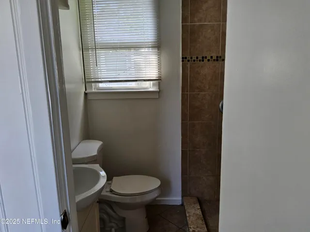 a bathroom with a toilet and a sink