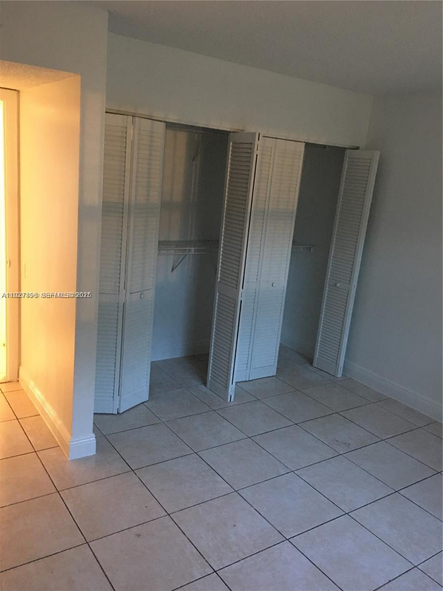 4431 Treehouse Lane, Unit H Tamarac, FL 33319 - Photo 9 of 10 a view of an empty room