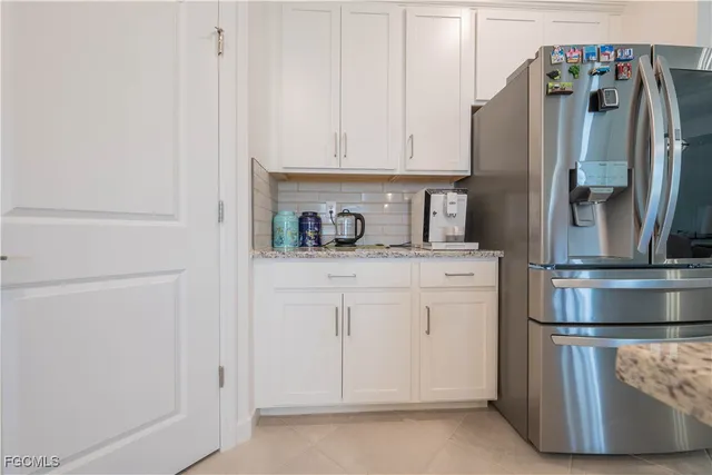 a kitchen with appliances and cabinets
