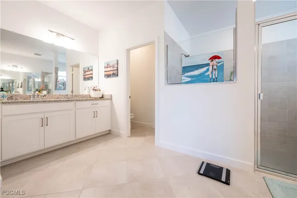 a kitchen with a refrigerator and a sink