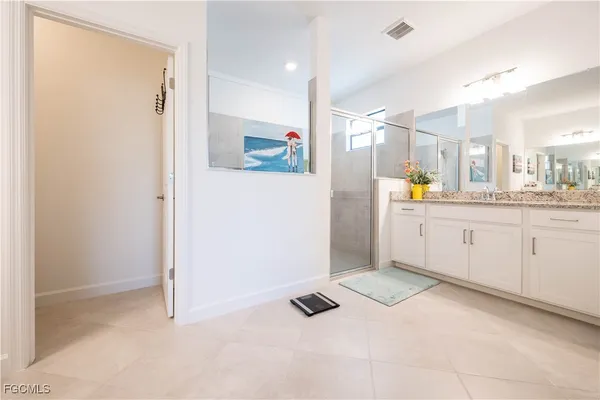 a kitchen with a refrigerator and a sink