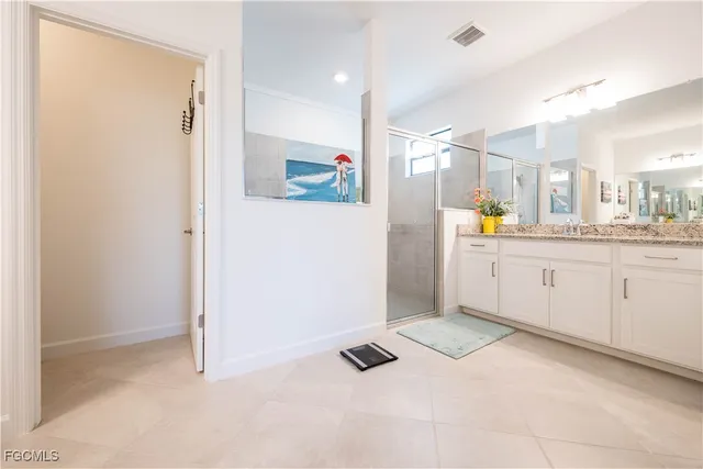 a kitchen with a refrigerator and a sink