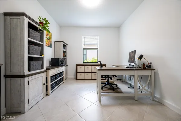 a kitchen with appliances cabinets and furniture