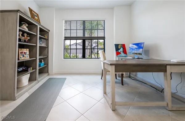 a workspace with furniture and window