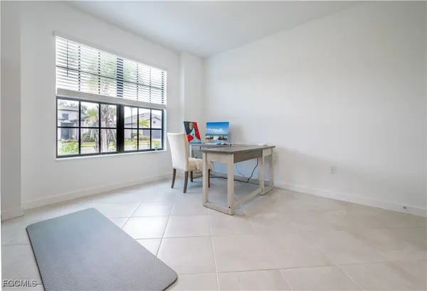 a workspace room with a window
